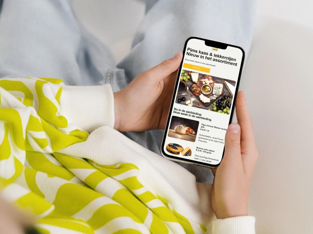 De site van Pims Kaas op een telefoon, met een bericht over nieuwe producten in het assortiment